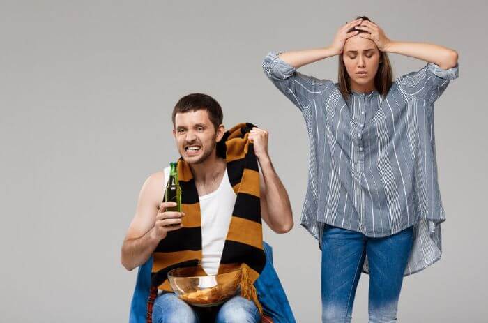 Non-alcoholic girl irritated by alcoholic boy